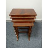 A REPRODUCTION SET OF FOUR MAHOGANY SIDE TABLES, 59.5 cms high, 58.5 cms wide, 39 cms deep the