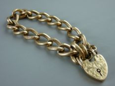 A NINE CARAT GOLD LINK BRACELET with bright cut padlock and safety chain, 25 grms