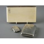 A SILVER CIGARETTE CASE with chased decoration and a similar style vesta, Birmingham 1916 and 1899