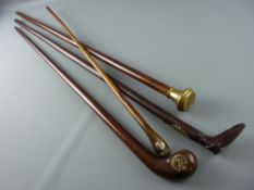 FOUR VINTAGE WALKING CANES, one handle in the form of a boot, all with metal plaques or insets