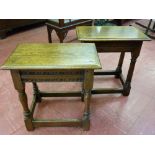 TWO OAK OBLONG TOPPED RUSTIC COFFEE TABLES with turned and block supports and oblong stretchers