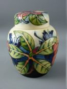 A MOORCROFT 'SIMEON' LIDDED GINGER JAR by Gibson, 15.5 cms high