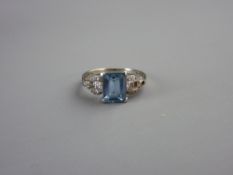 A SILVER DRESS RING with oblong cut aquamarine and tiny flanking diamonds, 2.7 grms, size 'L'
