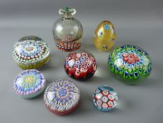 A COLLECTION OF EIGHT GLASS MILLEFIORI CANE INSET PAPERWEIGHTS, 10 cms diameter the largest