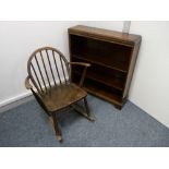 A NEAT POLISHED OPEN BOOKCASE with adjustable shelves, 77 cms wide and an Ercol rocking chair