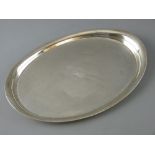 AN OVAL SILVER ENGINE TURNED TRAY with centre monogram, 13 troy ozs, Birmingham 1946