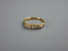 AN EIGHTEEN CARAT GOLD DRESS RING with five tiny diamonds, 2.5 grms, size 'Q'