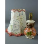 A MOORCROFT 'CORAL HIBISCUS' TABLE LAMP decorated on an ivory ground with cloth covered floral