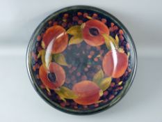 A MOORCROFT 'POMEGRANATE' IMPRESSIVE 33 cms DIAMETER FRUIT BOWL, decorated inside and out, on a