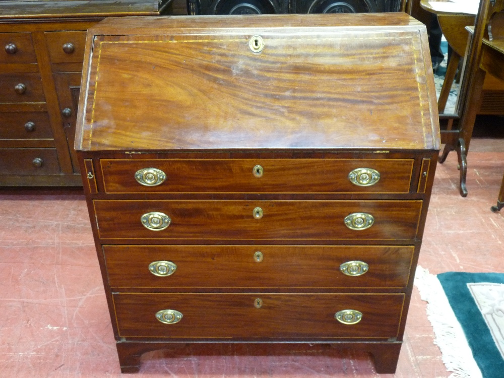 A 19th CENTURY MAHOGANY & DART INLAID BUREAU having a slope front over four graduated drawers, all