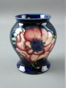 A SMALL MOORCROFT 'ANEMONE' GLOBULAR VASE decorated on a cobalt ground, Moorcroft, Made in England