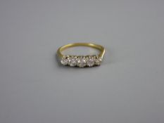 AN UNMARKED GOLD DRESS RING with five small diamonds, visual estimate 1.4 carats, 2.5 grms, size '