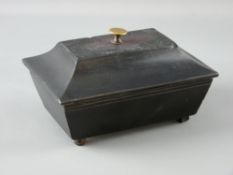 A WELSH SLATE FOLK ART piece in the form of a sarcophagus shaped lidded casket, the lid with brass