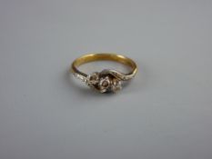 AN EIGHTEEN CARAT GOLD THREE STONE DIAMOND CROSSOVER RING, visual estimate of diamonds 0.2 carat