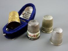 A CASED FLORAL DECORATED NINE CARAT GOLD THIMBLE, 4.5 grms, a silver and floral banded thimble, 7