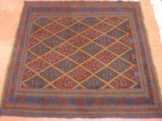 A TRIBAL CAZAK RUG, blue and red ground with repeating central diamond pattern and multi-bordered