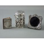 THREE ITEMS OF SMALL SILVER including an ornately covered ruby glass salts bottle with hinged lid (