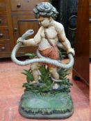 A VICTORIAN CAST IRON STICKSTAND modelled as a young Hercules wrestling a serpent, with pierced