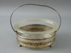 A GLASS BUTTER DISH ON A PIERCED SILVER STAND, 2.3 troy ozs, London 1929