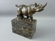 A BRONZE STUDY OF A RHINOCEROS ON A MARBLE BASE, 19 cms high maximum, 18 cms wide overall, 20th