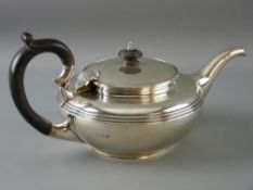 A SILVER BULLET SHAPED TEAPOT with lined decoration, 19 troy ozs gross, London 1921