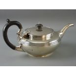 A SILVER BULLET SHAPED TEAPOT with lined decoration, 19 troy ozs gross, London 1921