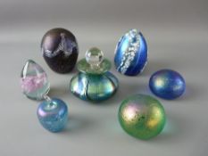 FIVE IRIDESCENT GLASS PAPERWEIGHTS and one other along with an iridescent squat scent bottle with