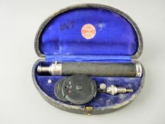 A CASED OPTHALMOSCOPE BY ALEXANDER & FOWLER