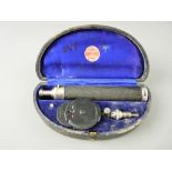 A CASED OPTHALMOSCOPE BY ALEXANDER & FOWLER