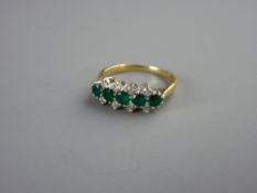 AN EIGHTEEN CARAT GOLD DIAMOND & EMERALD DRESS RING having five round cut emeralds with four tiny