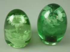 TWO LARGE VICTORIAN GREEN GLASS DUMP PAPERWEIGHTS having snapped and polished pontils, both with