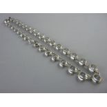 A WHITE METAL NECKLACE of large round cut czs, 23 grms gross