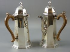 A PAIR OF PLAIN SILVER CHOCOLATE POTS of slightly domed octagonal form and with a domed and