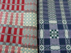 TWO VINTAGE TRADITIONAL WELSH WOOLLEN BEDSPREADS, one tie woven in purple and green patterned tones,