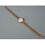 A LADY'S NINE CARAT GOLD CIRCULAR DIAL TUDOR ROYAL WRISTWATCH with nine carat gold dart bracelet, 16