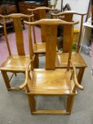 A SET OF FOUR (THREE PLUS ONE) LIGHT COLOUR HARDWOOD CHINESE CHAIRS, dragon motif to the central
