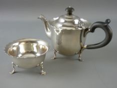 A TWO PIECE SILVER BACHELOR TEA SERVICE of teapot and sugar basin with crimped edging, each piece on