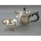 A TWO PIECE SILVER BACHELOR TEA SERVICE of teapot and sugar basin with crimped edging, each piece on