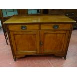 A COMPACT MAHOGANY SIDEBOARD having a railback with two drawers and two cupboards and on corner