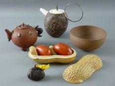 A CHINESE YIXING RED WARE TEAPOT of naturalistic form, a pot and cover with contents in the form