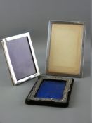 TWO PLAIN SILVER EASEL PICTURE FRAMES and another (distressed)