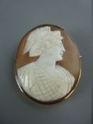 A LARGE NINE CARAT GOLD FRAMED OVAL CAMEO BROOCH, head and shoulders of a classical lady, 5 x 4 cms