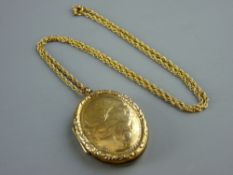 AN OVAL NINE CARAT GOLD FRONT & BACK LOCKET with fine link chain, 8.5 grms gross