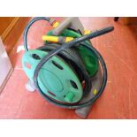 Garden hose reel with hose lock attachments