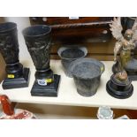 Pair of metallic vases on square plinths, a pair of pewter planter pots, an angel ornament and a