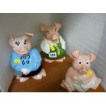 Three Nat West pigs