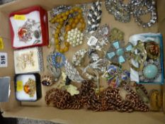 Box of costume jewellery including a string of amber coloured beads