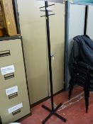 Modern metal coatstand and an unopened roll of Barrier Plus underlay