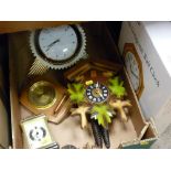 Modern twin weight cuckoo clock, a starburst wall clock and two others and a boxed wall clock