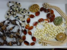 Small tray of costume jewellery to include an agate necklace